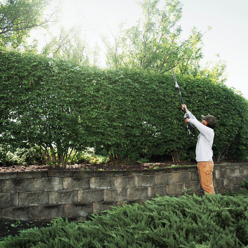 EGO Commercial 21 inch Extended Pole Hedge Trimmer in use